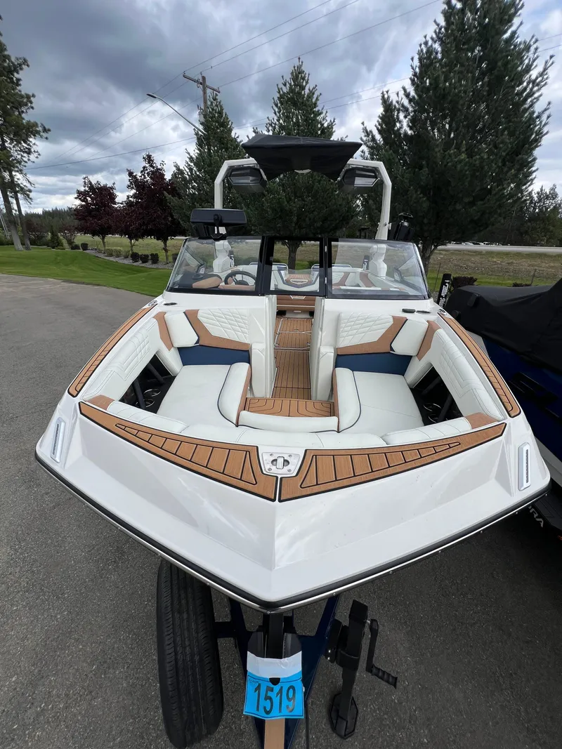 Slide: The Image of 2024 Nautique Super Air G23 boat with sleek design and luxurious seating. - 3