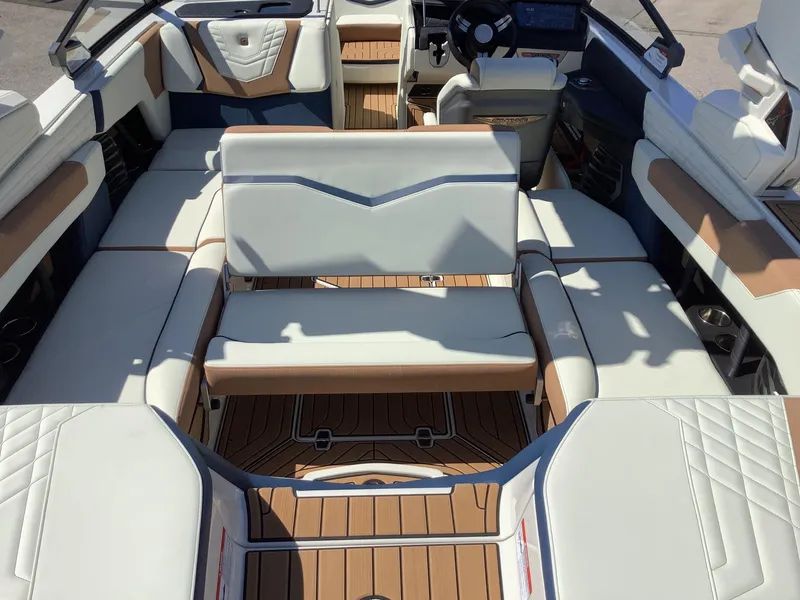 Slide: The Image of 2024 Nautique Super Air G23 interior with luxurious seating and modern design. - 33