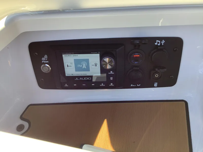 Slide: The Image of 2024 Nautique Super Air G23 audio control panel with JL Audio system. - 34