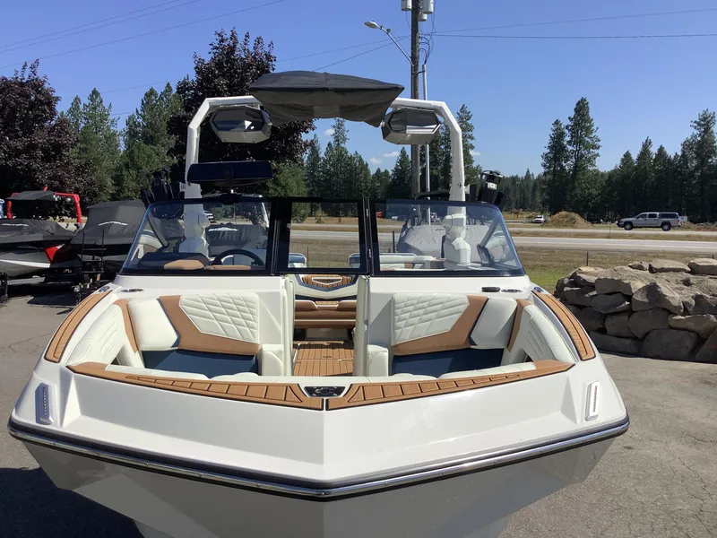 Slide: The Image of 2024 Nautique Super Air G23 boat with sleek design and luxurious seating. - 4