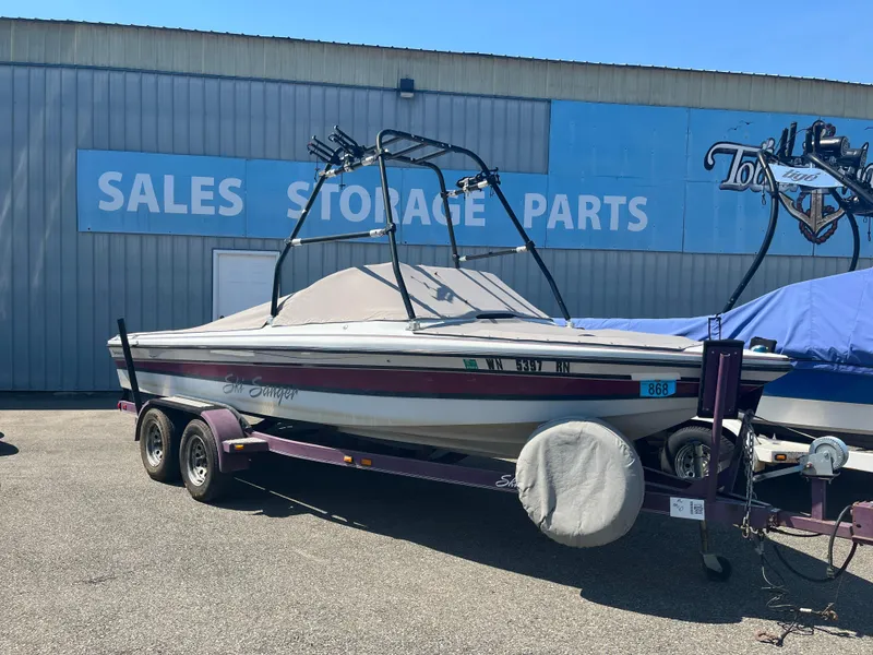 Slide: The Image of 1999 Sanger Ski Sanger boat on trailer outside sales and storage facility. - 4