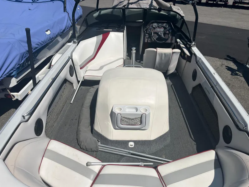 Slide: The Image of 1999 Sanger Ski Sanger boat interior with seating and steering wheel. - 7