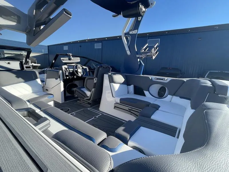 Slide: The Image of 2023 Supra SA 450 boat interior with modern seating and sleek design. - 12