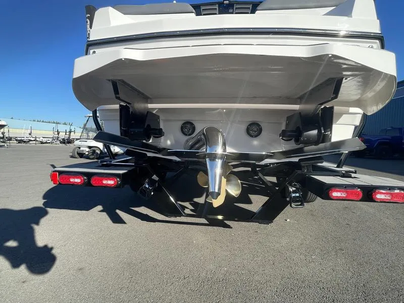 Slide: The Image of 2023 Supra SA 450 boat rear view with propeller and trailer. - 8