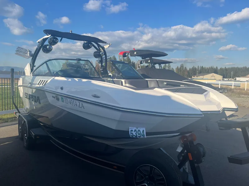 Slide: The Image of 2017 Supra SA 450 boat on trailer under blue sky. - 12