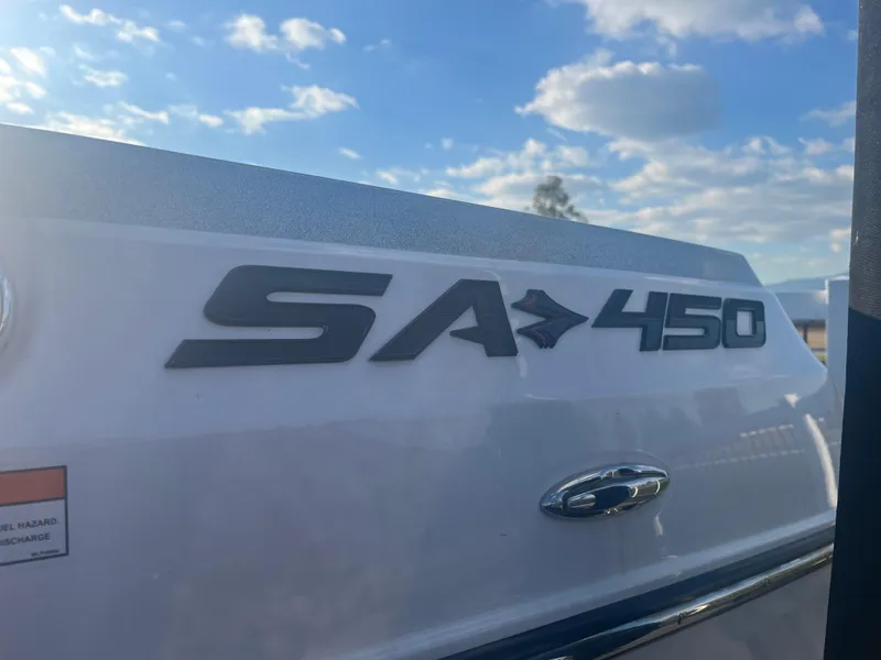 Slide: The Image of 2017 Supra SA 450 boat logo under a blue sky. - 13
