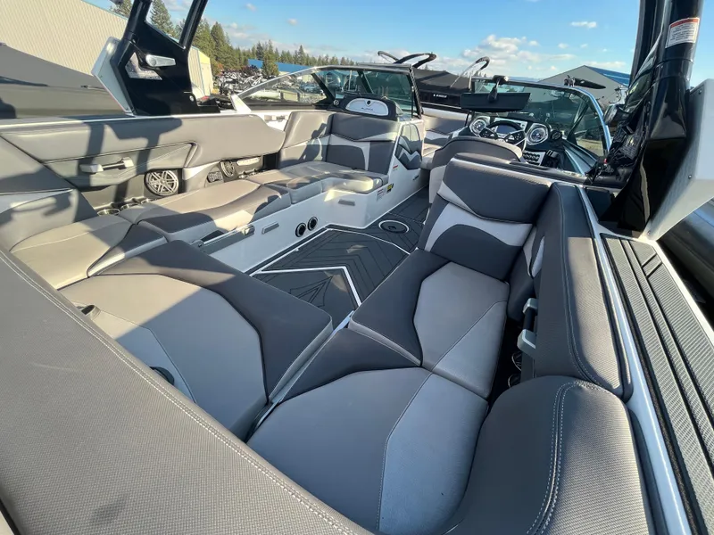 Slide: The Image of 2017 Supra SA 450 boat interior with gray seating and modern dashboard. - 17