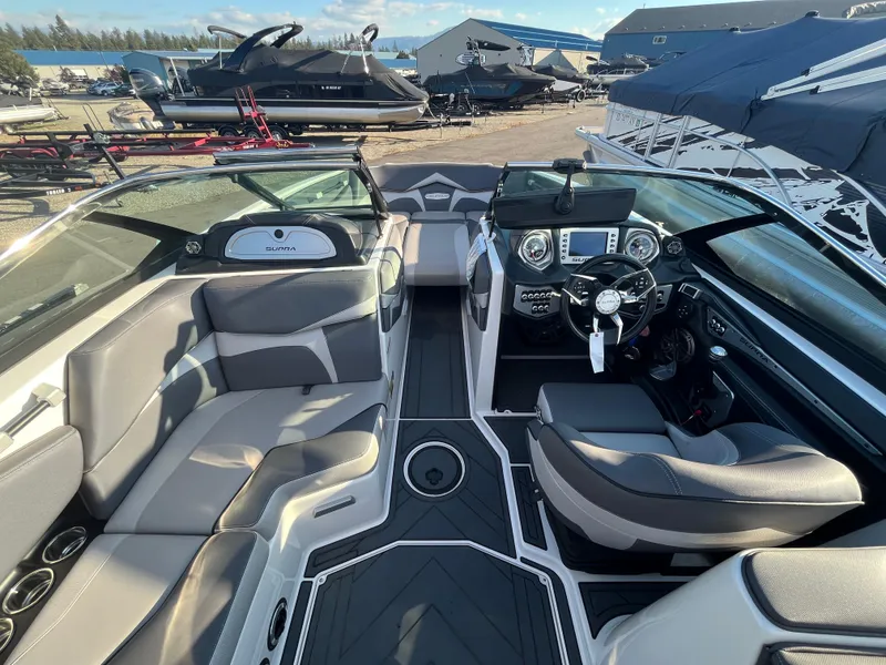 Slide: The Image of Interior of a 2017 Supra SA 450 boat with modern dashboard and seating. - 18