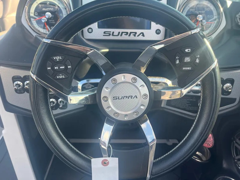 Slide: The Image of 2017 Supra SA 450 steering wheel with control buttons and dashboard view. - 21