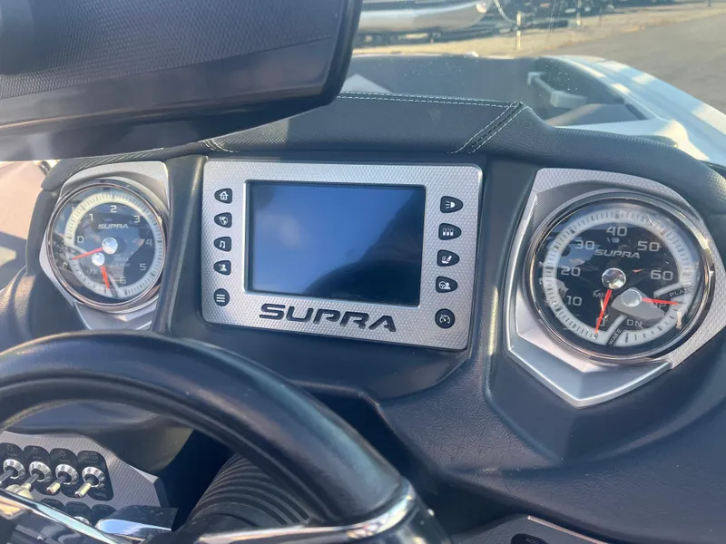 Slide: The Image of Dashboard of 2017 Supra SA 450 boat with gauges and digital display. - 25