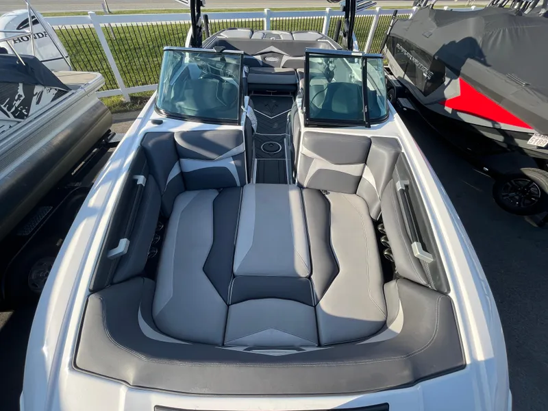 Slide: The Image of 2017 Supra SA 450 boat interior with gray seating and open windshield. - 27