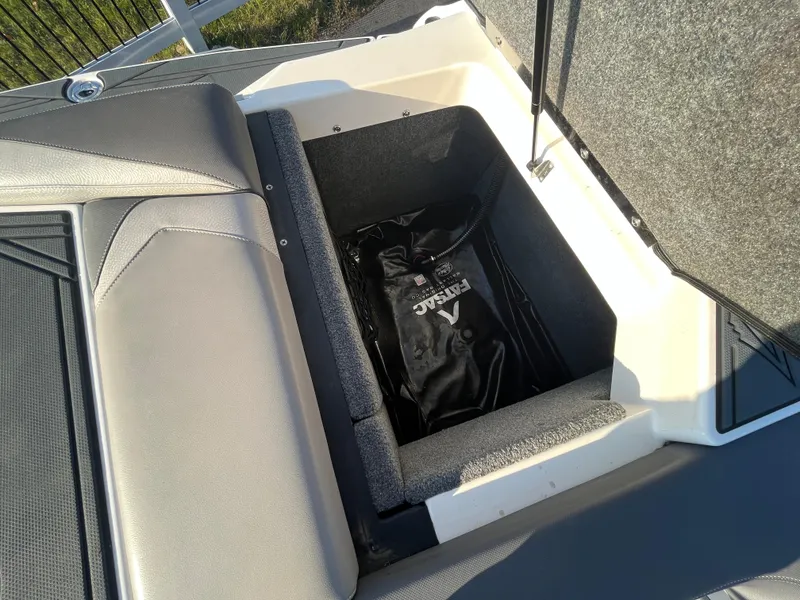 Slide: The Image of 2017 Supra SA 450 boat storage compartment with ballast bag. - 28