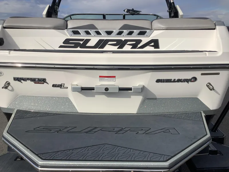 Slide: The Image of 2017 Supra SA 450 boat rear view with Raptor 6.2L engine and SwellSurf system. - 34