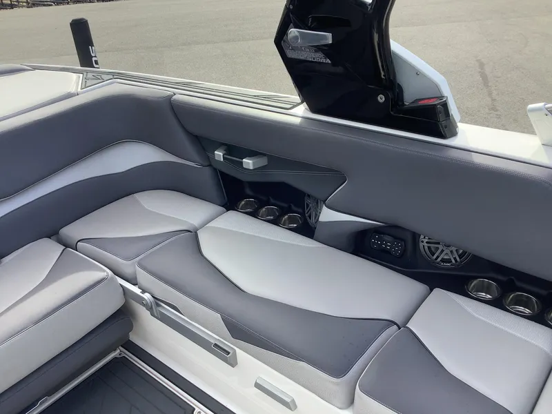Slide: The Image of 2017 Supra SA 450 boat interior with gray seating and cup holders. - 37