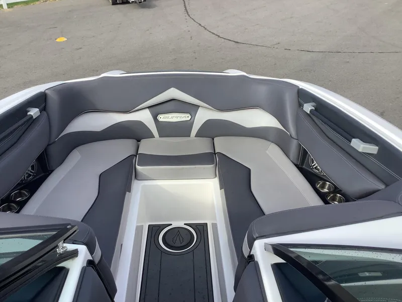 Slide: The Image of 2017 Supra SA 450 boat interior with gray seating and cup holders. - 43
