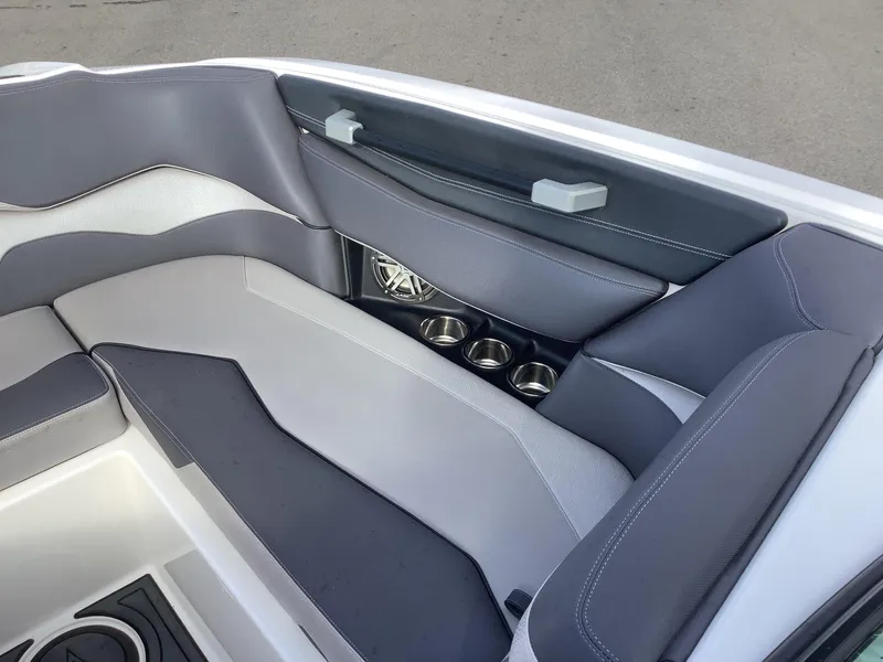 Slide: The Image of 2017 Supra SA 450 boat interior with gray seating and cup holders. - 44