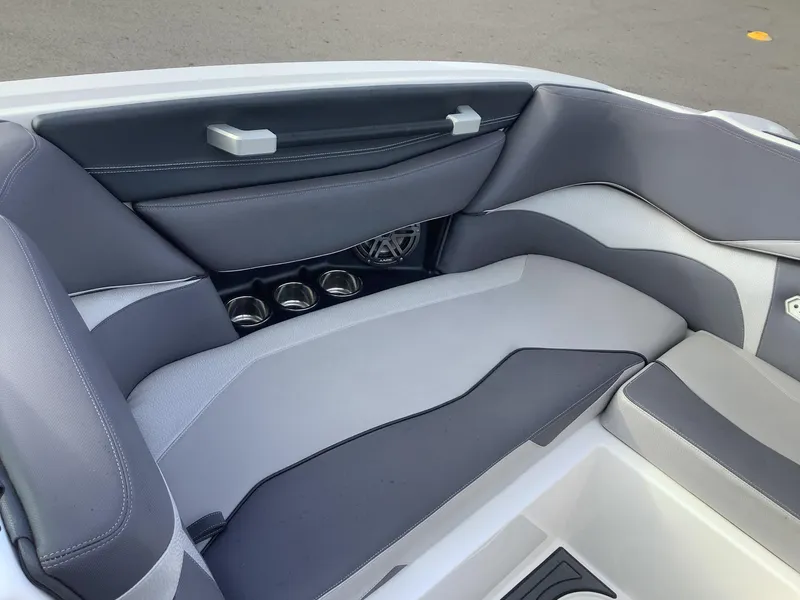 Slide: The Image of 2017 Supra SA 450 boat interior with gray seating and cup holders. - 45