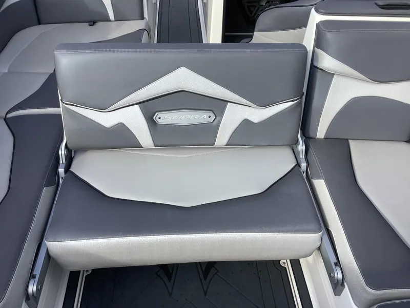 Slide: The Image of 2017 Supra SA 450 boat interior with gray and black seating. - 47