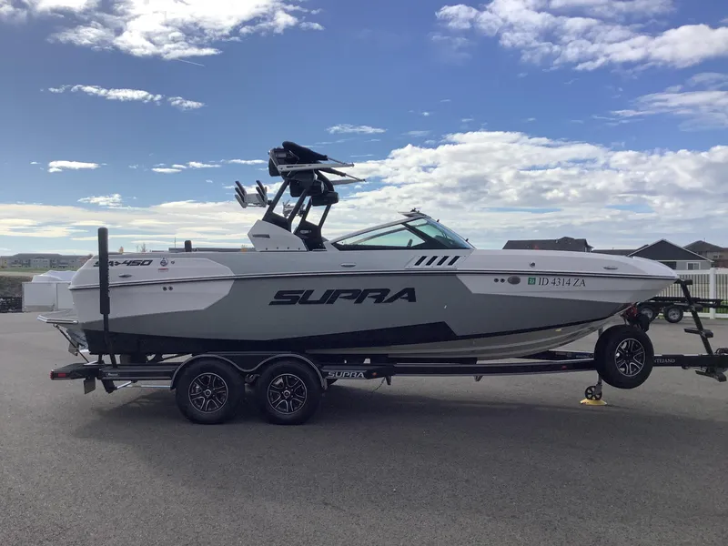 Slide: The Image of 2017 Supra SA 450 boat on trailer under cloudy sky. - 5