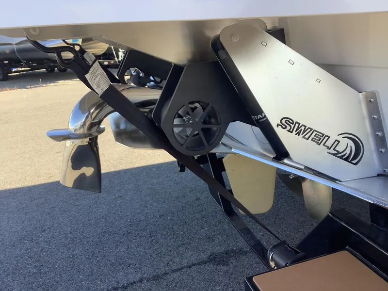 Slide: The Image of 2023 Supra SE 550 boat with Swell surf system and propeller detail. - 12