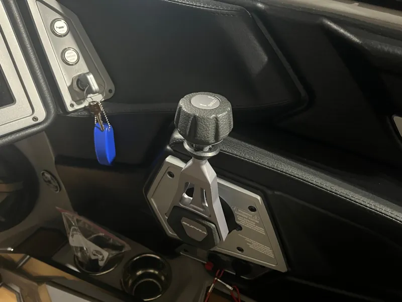 Slide: The Image of 2023 Supra SE 550 interior controls with key and throttle lever. - 16