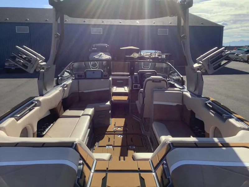 Slide: The Image of 2023 Supra SE 550 boat interior with luxurious seating and advanced features. - 28