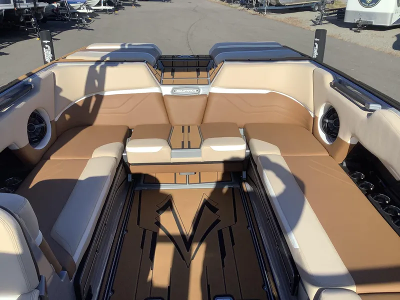 Slide: The Image of 2023 Supra SE 550 boat interior with tan seating and modern design. - 29