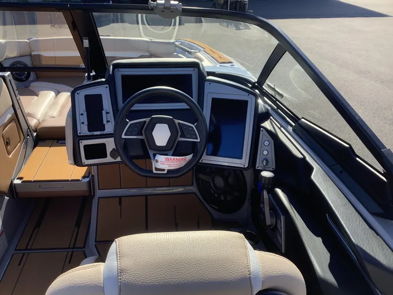 Slide: The Image of 2023 Supra SE 550 boat interior with modern dashboard and steering wheel. - 34
