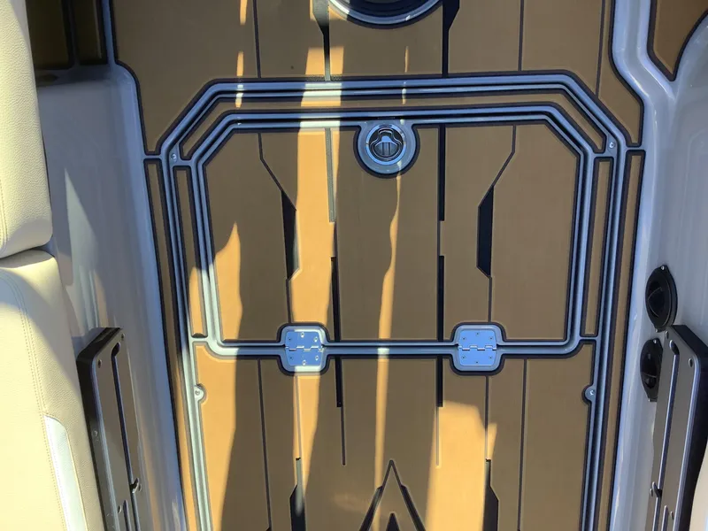 Slide: The Image of 2023 Supra SE 550 boat interior with sleek, modern design and wood-like flooring. - 35