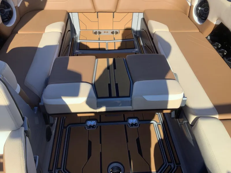 Slide: The Image of 2023 Supra SE 550 boat interior with tan and white seating, featuring modern design elements. - 37