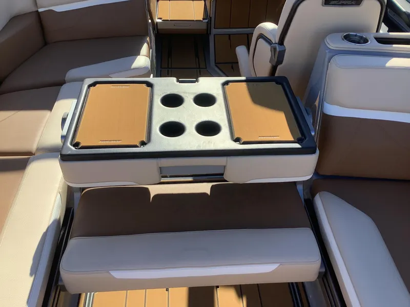 Slide: The Image of 2023 Supra SE 550 boat interior with seating and cup holders. - 38