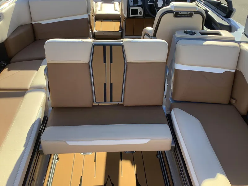 Slide: The Image of 2023 Supra SE 550 boat interior with beige and brown seating, modern design. - 39