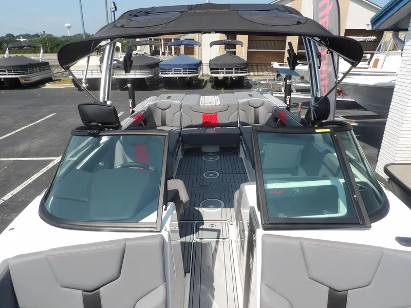 Slide: The Image of 2024 MasterCraft XT25 boat with sleek interior and modern design. - 10