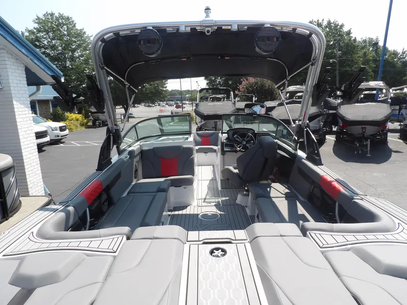 Slide: The Image of 2024 MasterCraft XT25 boat interior with spacious seating and modern design. - 6