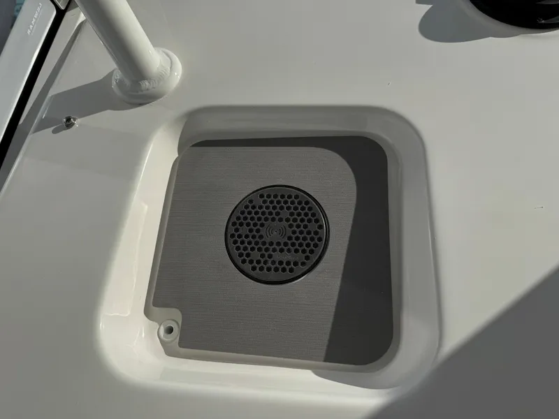 Slide: The Image of 2025 Regulator 26XO boat deck with integrated speaker. - 16