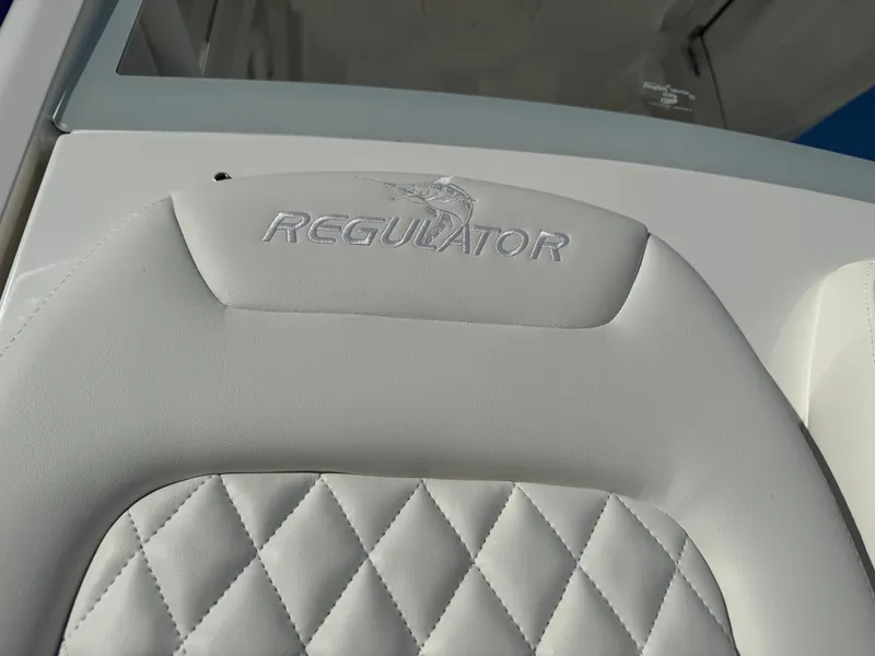 Slide: The Image of 2025 Regulator 26XO boat seat with embroidered logo and diamond stitching. - 22