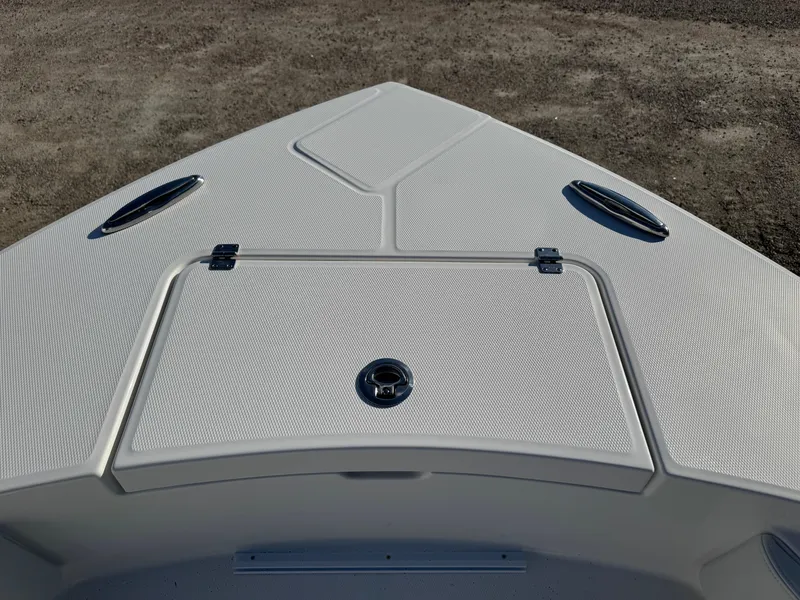 Slide: The Image of Bow of 2025 Regulator 26XO boat with storage hatch and cleats. - 27