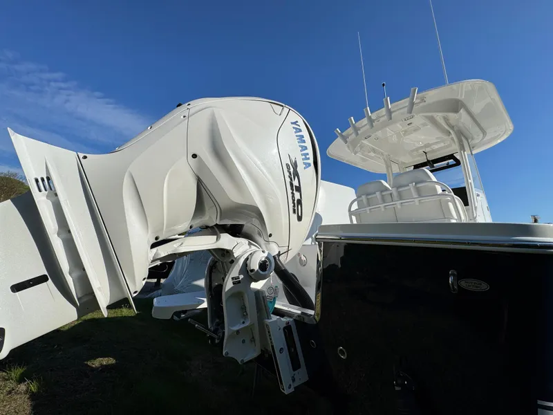 Slide: The Image of 2025 Regulator 26XO boat with Yamaha outboard motor under clear blue sky. - 5