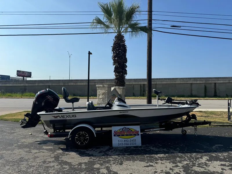 The Image of 2025 Vexus AVX 1880 boat on trailer, parked outdoors near palm tree. - 1