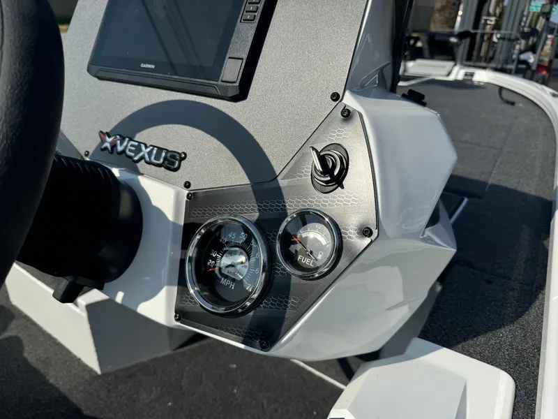 Slide: The Image of 2025 Vexus AVX 1880 boat dashboard with speedometer and fuel gauge. - 10