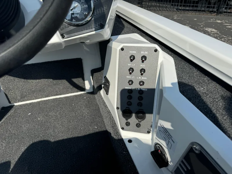 Slide: The Image of Control panel of 2025 Vexus AVX 1880 boat with switches and gauges. - 12