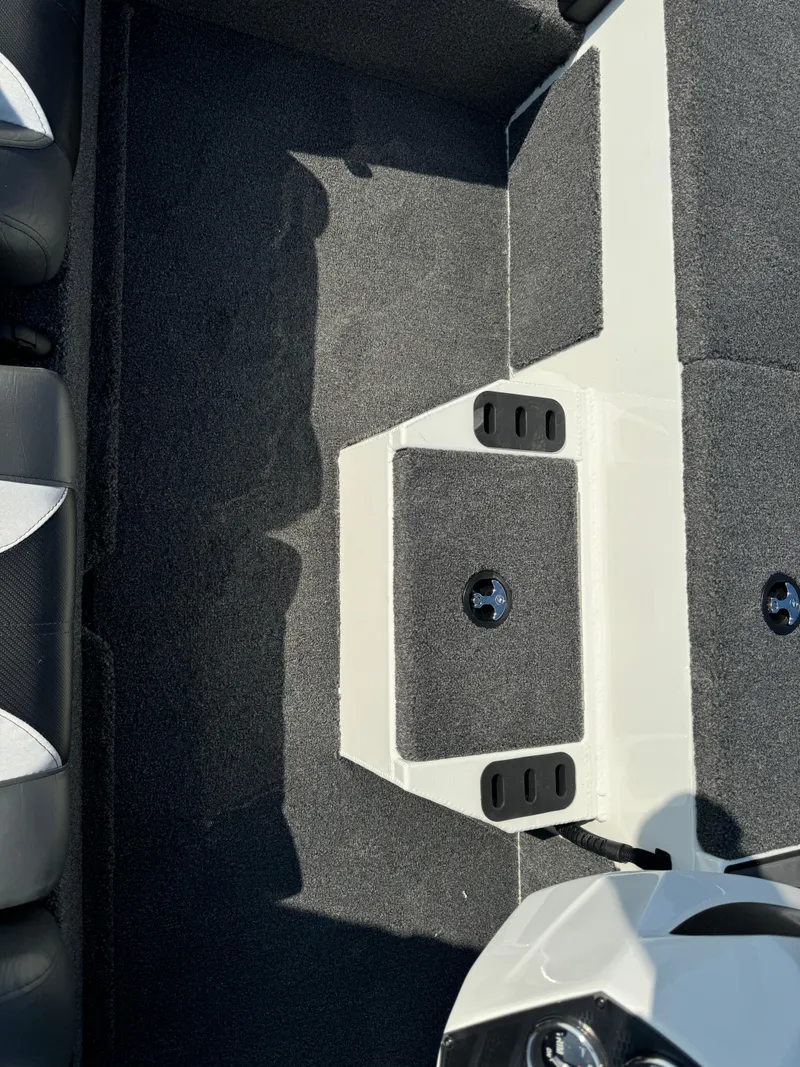 Slide: The Image of 2025 Vexus AVX 1880 boat interior with carpeted flooring and storage compartments. - 20