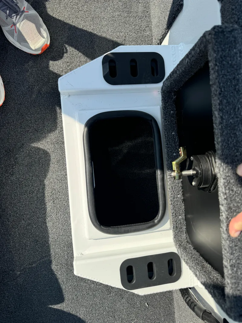 Slide: The Image of 2025 Vexus AVX 1880 boat storage compartment with carpeted interior. - 21