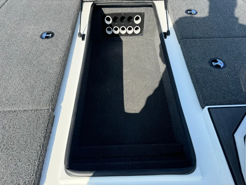 Slide: The Image of 2025 Vexus AVX 1880 boat storage compartment with rod holders. - 23