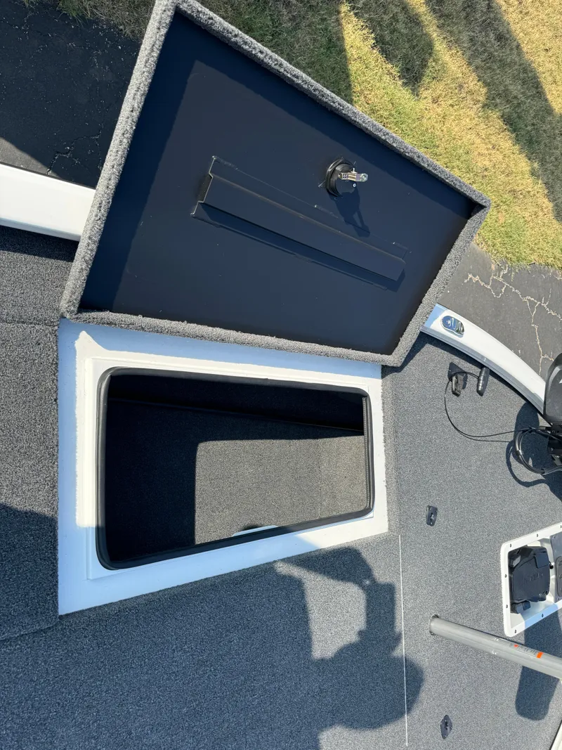 Slide: The Image of Open storage compartment on 2025 Vexus AVX 1880 boat deck. - 24