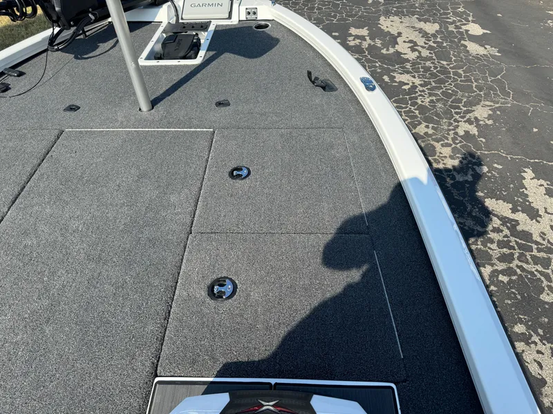 Slide: The Image of 2025 Vexus AVX 1880 boat deck with storage compartments and Garmin equipment. - 25