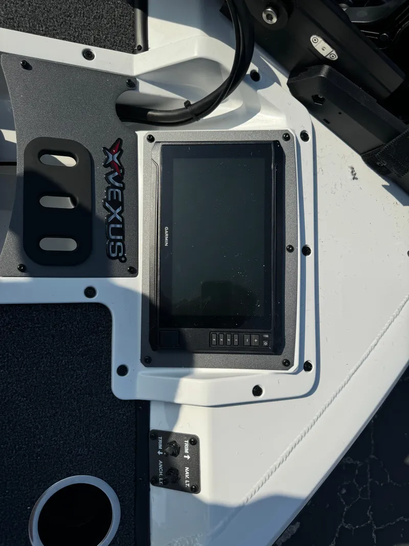 Slide: The Image of 2025 Vexus AVX 1880 boat dashboard with electronic display and controls. - 30