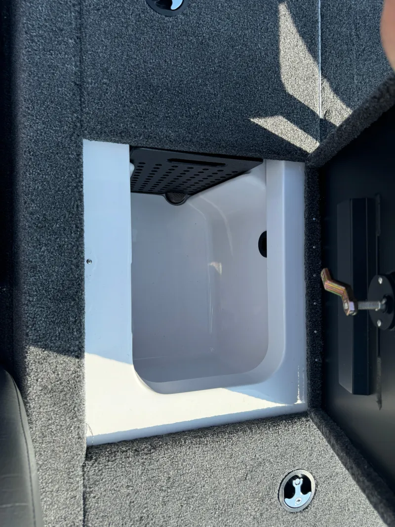 Slide: The Image of 2025 Vexus AVX 1880 boat storage compartment with open lid. - 36