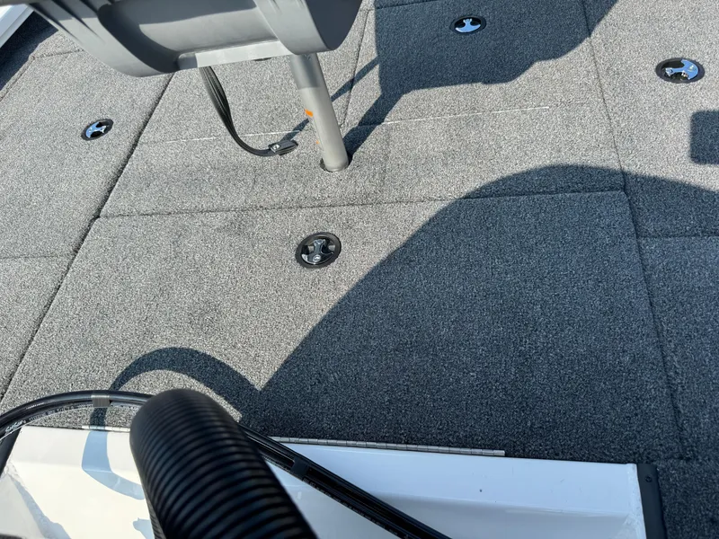 Slide: The Image of 2025 Vexus AVX 1880 boat deck with gray carpet and seat base. - 39