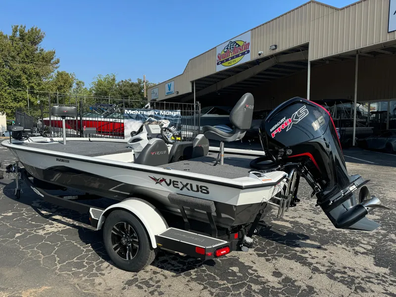 Slide: The Image of 2025 Vexus AVX 1880 boat with powerful outboard motor, parked outside dealership. - 4